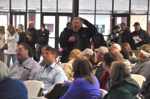 Officials field questions from residents affected by flooding