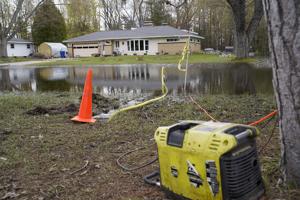 Cadillac lake levels down six inches from peak Friday as flood recovery efforts continue