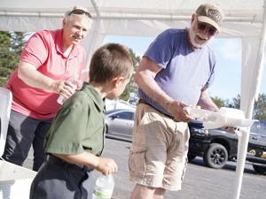 Flood victims, cleanup volunteers share meal in Cadillac