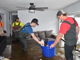 Friends, family help recover items from flooded home